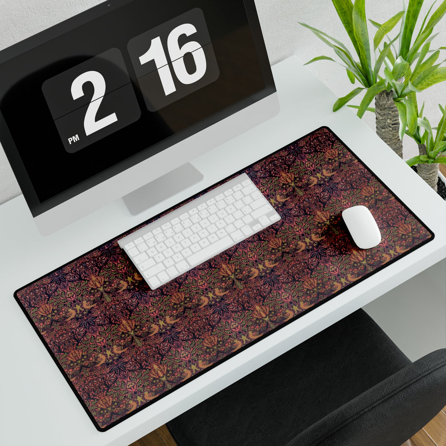 A large desk mat with a floral pattern, displayed on a desk with a keyboard and mouse, with a decorative border.