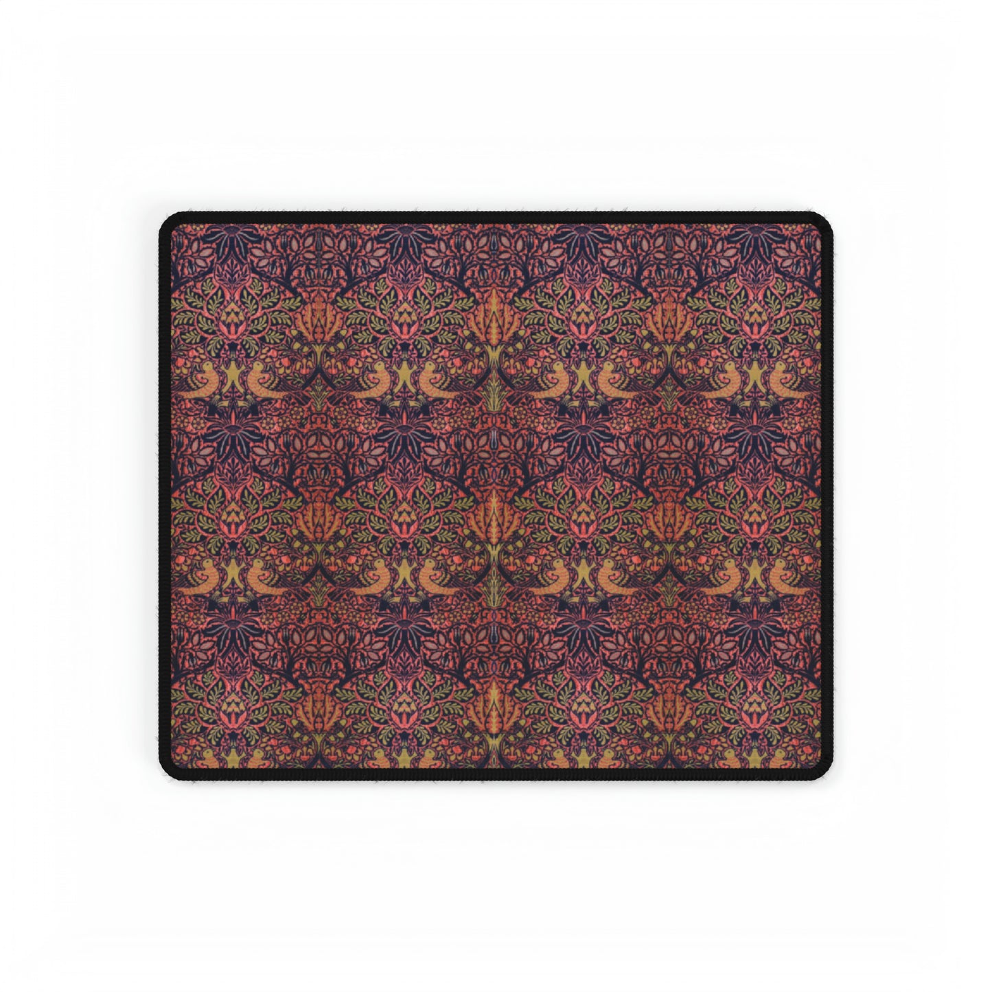 A large desk mat with a floral pattern, displayed on a desk with a keyboard and mouse, with a decorative border.