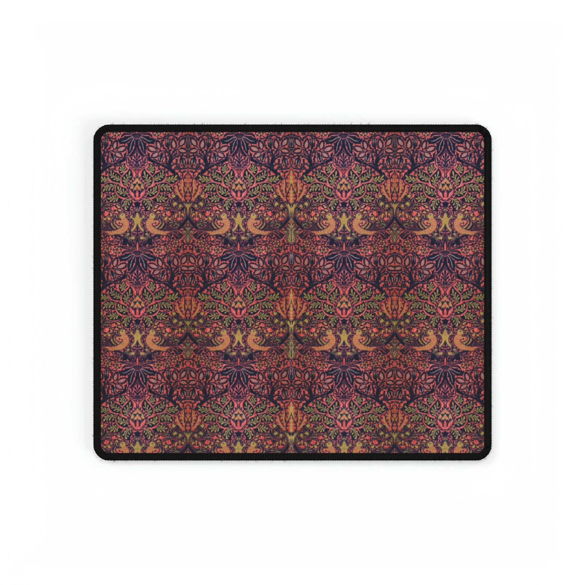 A large desk mat with a floral pattern, displayed on a desk with a keyboard and mouse, with a decorative border.