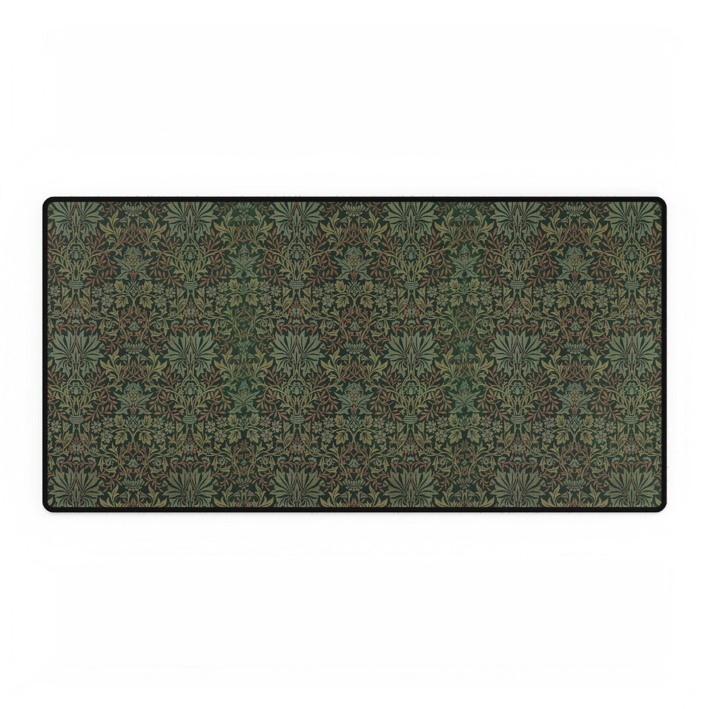 A rectangular desk mat with a floral garden pattern, placed under a desk with a keyboard and mouse on top.