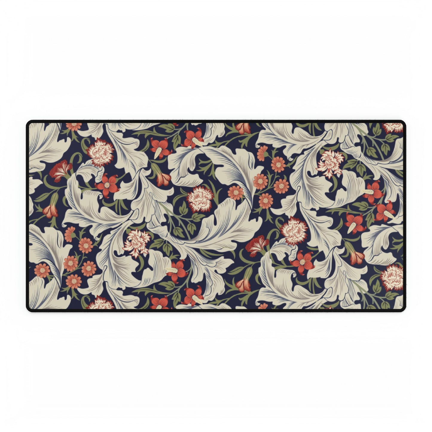 A large desk mat with a William Morris & Co floral pattern, inspired by William Morris, placed on a desk with a keyboard and mouse.