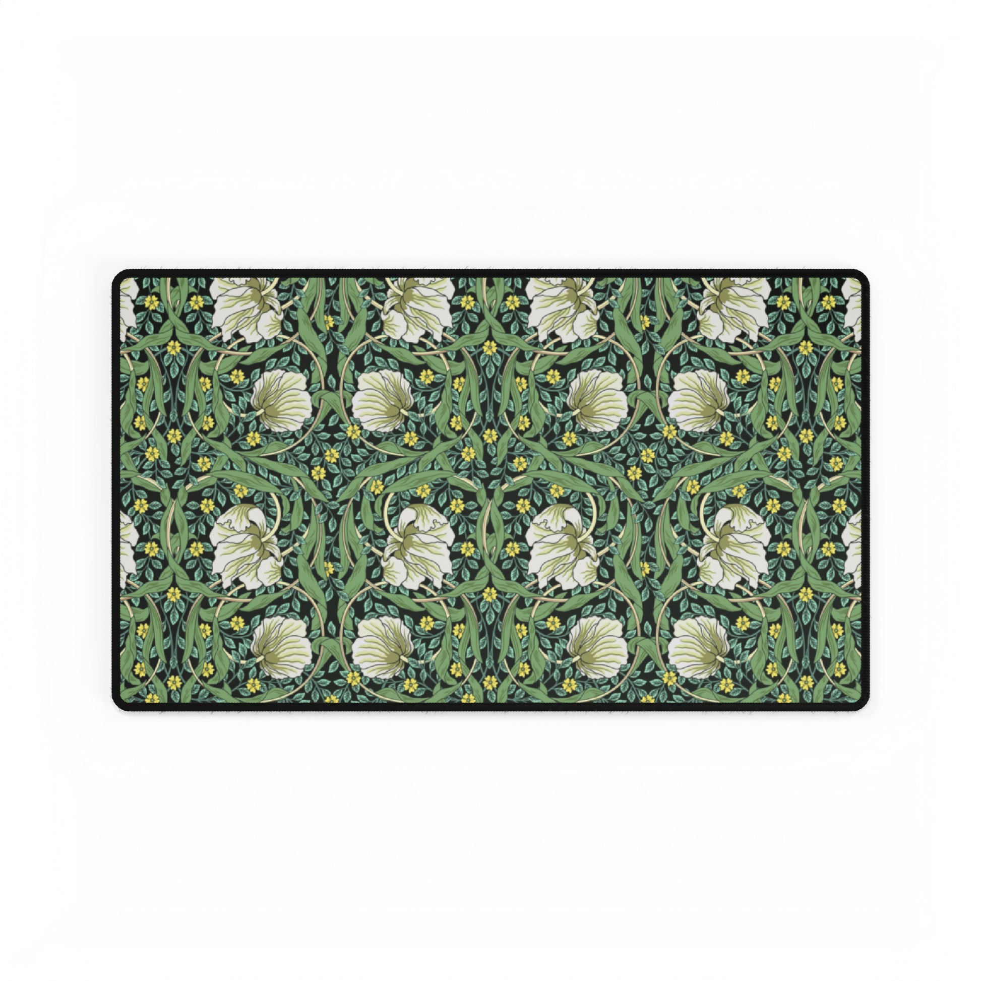 A rectangular desk mat with a green floral pattern, featuring a mouse pad on top. The desk mat is placed under a whiteboard with a digital display and a keyboard.