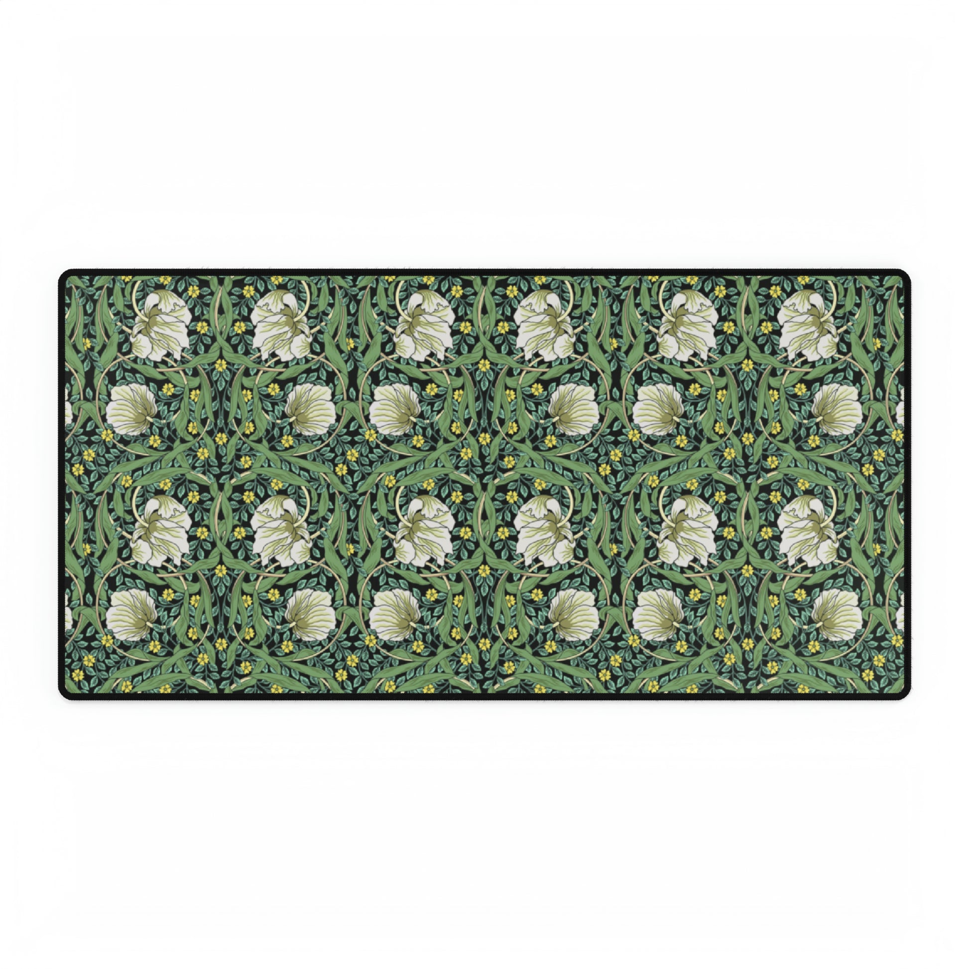 A rectangular desk mat with a green floral pattern, featuring a mouse pad on top. The desk mat is placed under a whiteboard with a digital display and a keyboard.