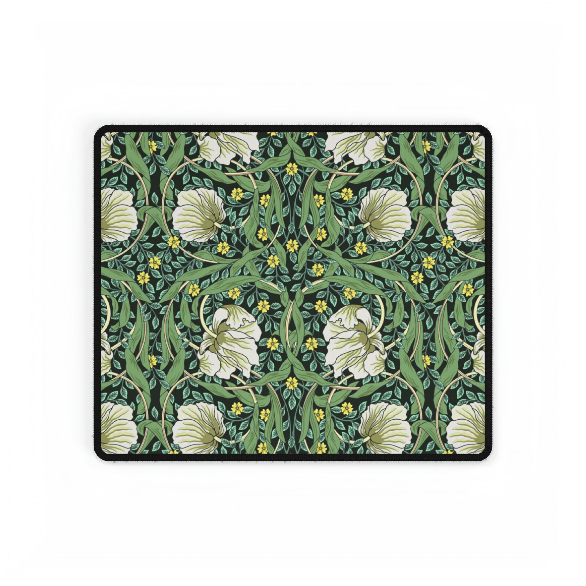 A rectangular desk mat with a green floral pattern, featuring a mouse pad on top. The desk mat is placed under a whiteboard with a digital display and a keyboard.