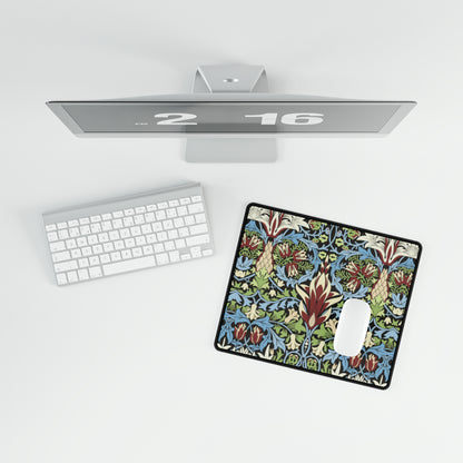 A large, decorative desk mat with a floral and geometric pattern, displayed on a desk with a keyboard and mouse.