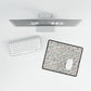 Floral mouse pad on a desk with a computer setup