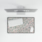 Floral desk mat with a computer setup on a white background