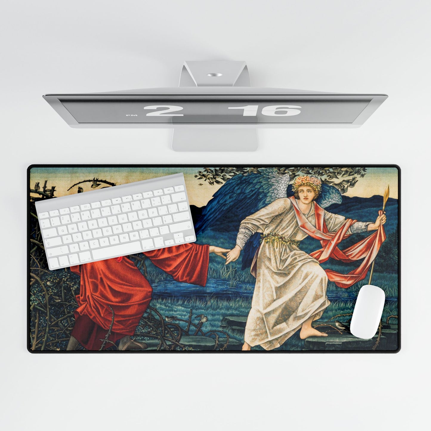 A desk mat with a floral and religious artwork design, accompanied by a computer keyboard and mouse on top of it, set against a white background.