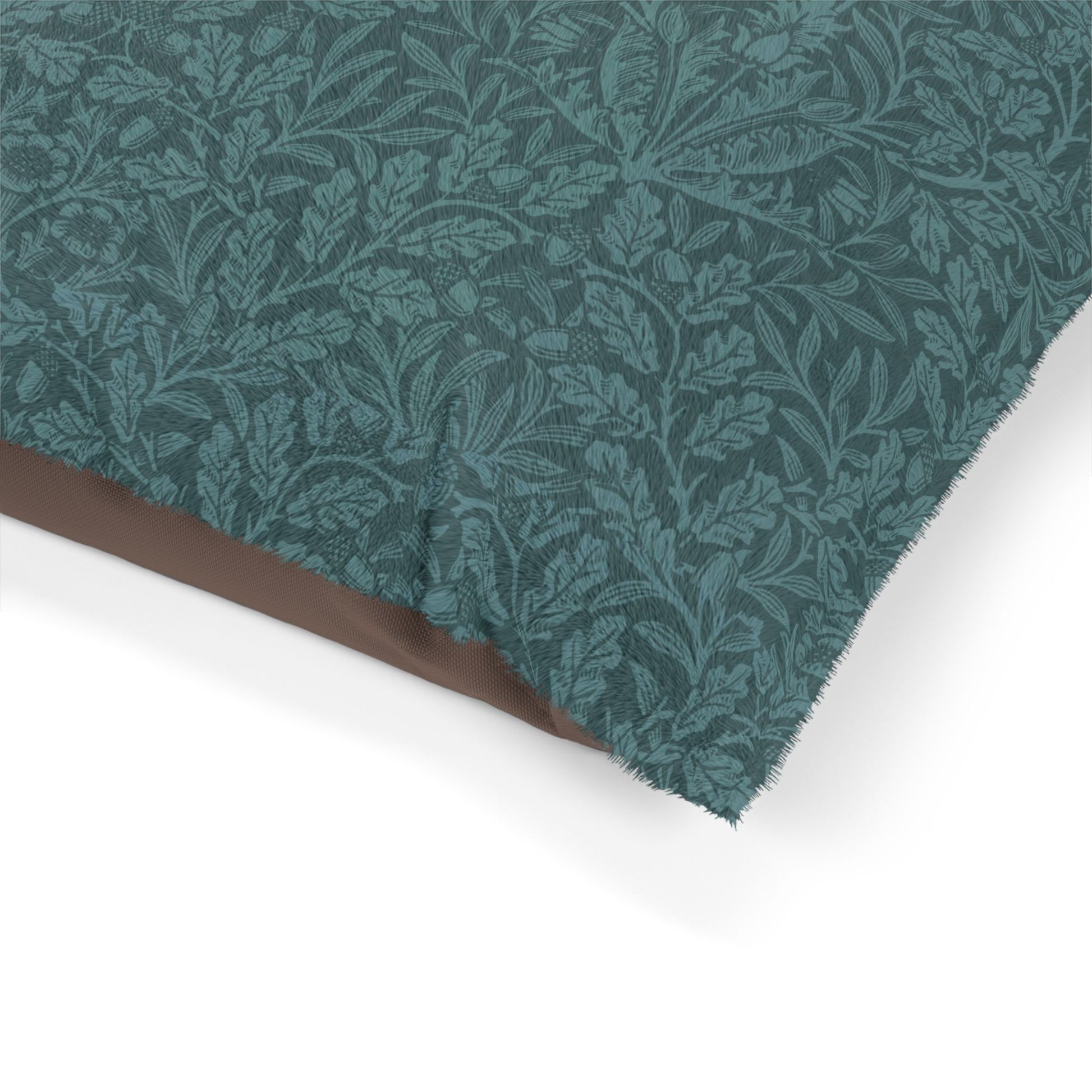 Teal fabric with leaf pattern on a white background