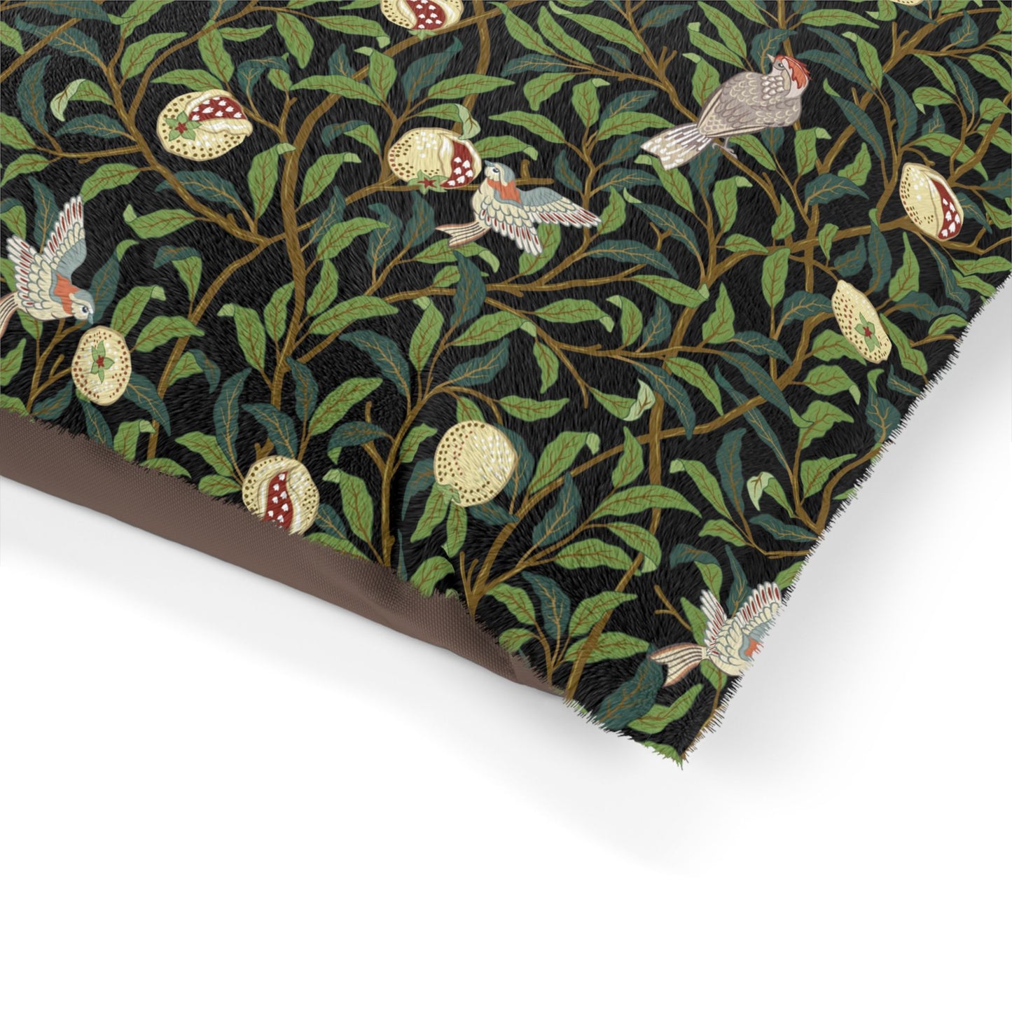 Fabric with a nature-themed pattern featuring leaves, flowers, and birds on a black background.