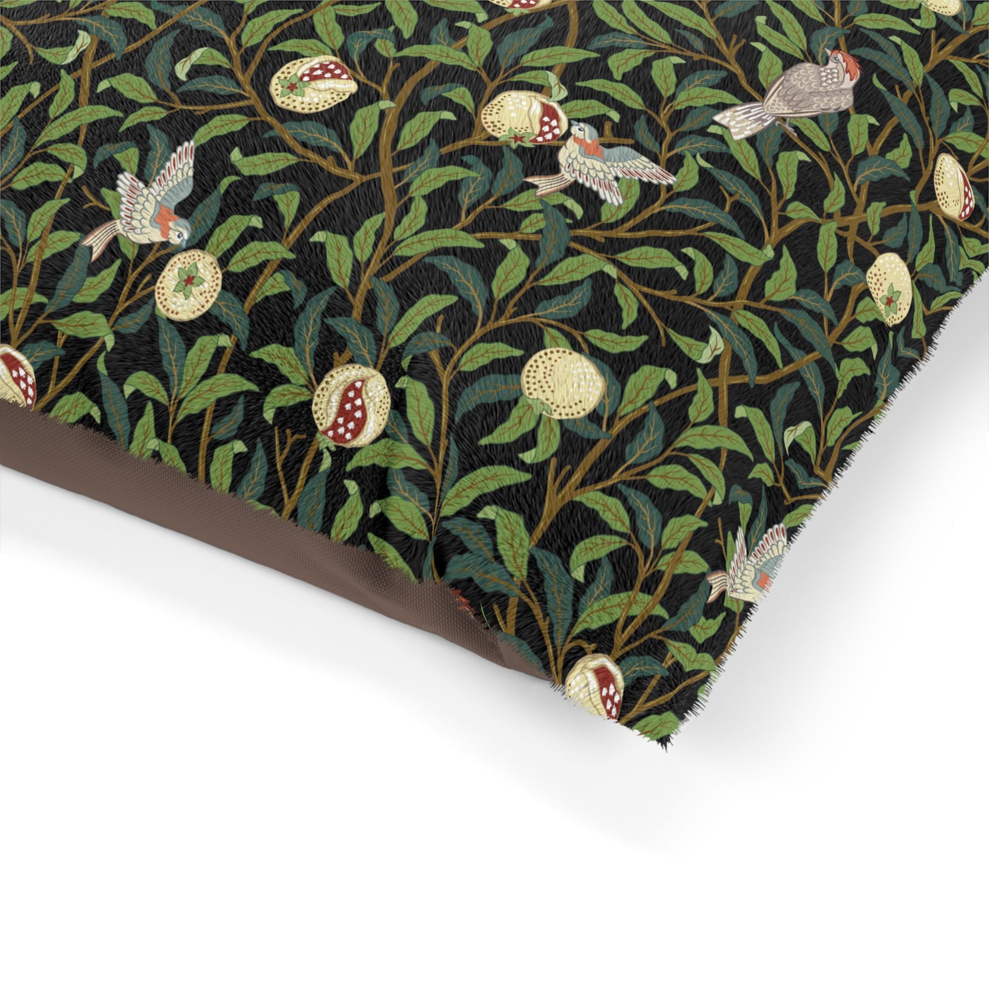 Fabric with a pattern of birds, flowers, and leaves on a black background