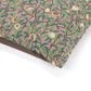 Fabric with a floral pattern on a pink background