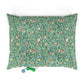 Decorative dog pillow with floral and bird William Morris & Co pattern on a white background