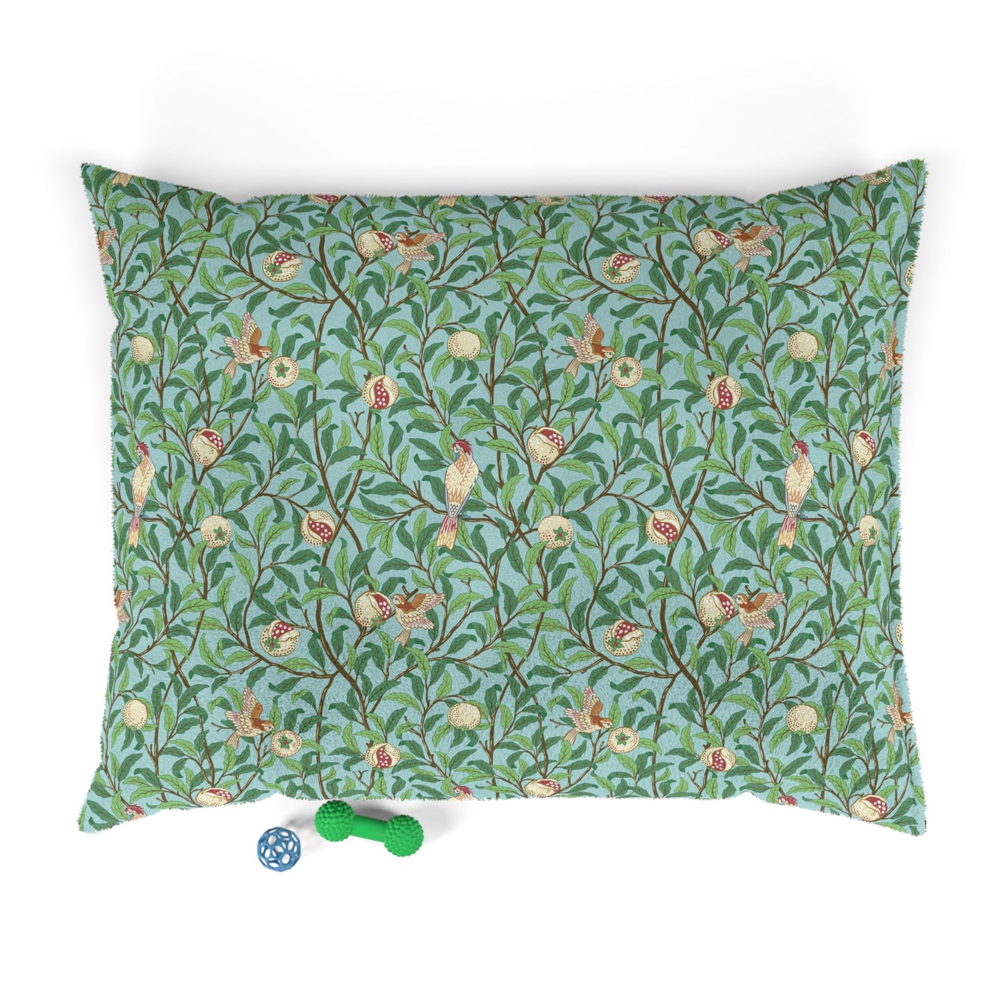 Decorative dog pillow with floral and bird William Morris & Co pattern on a white background