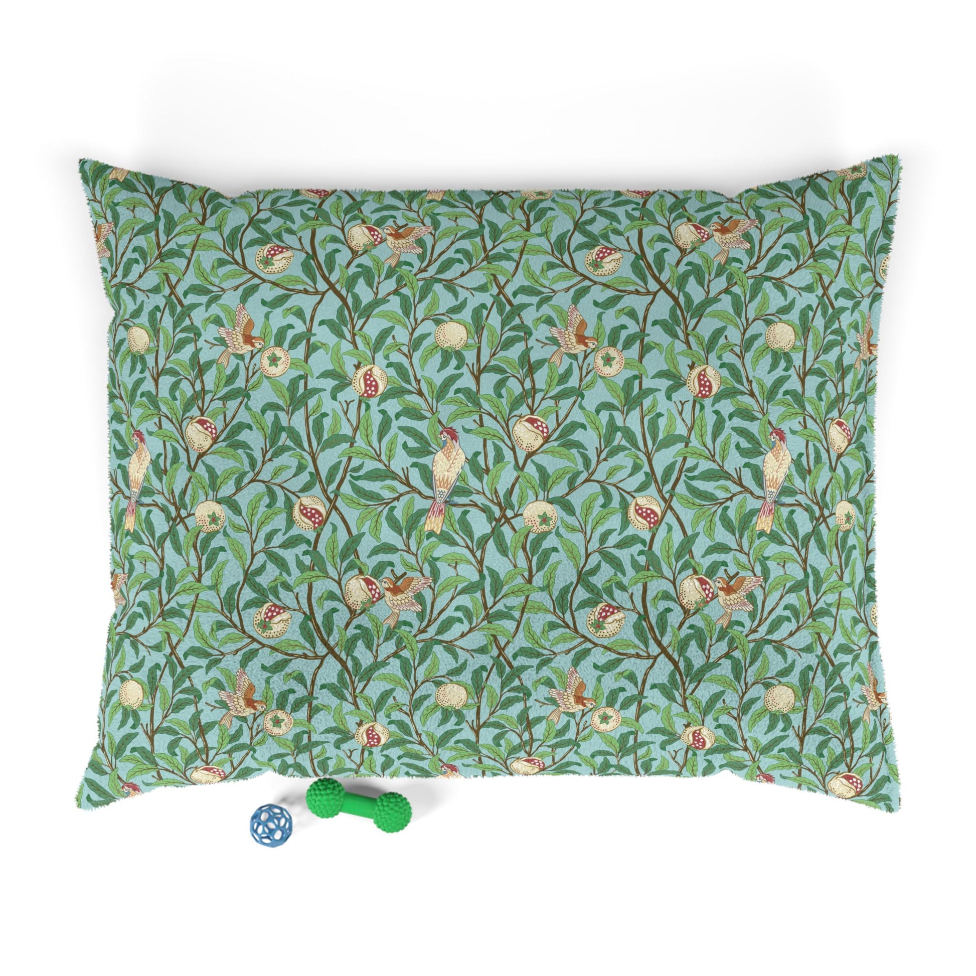 Decorative dog pillow with floral and bird William Morris & Co pattern on a white background