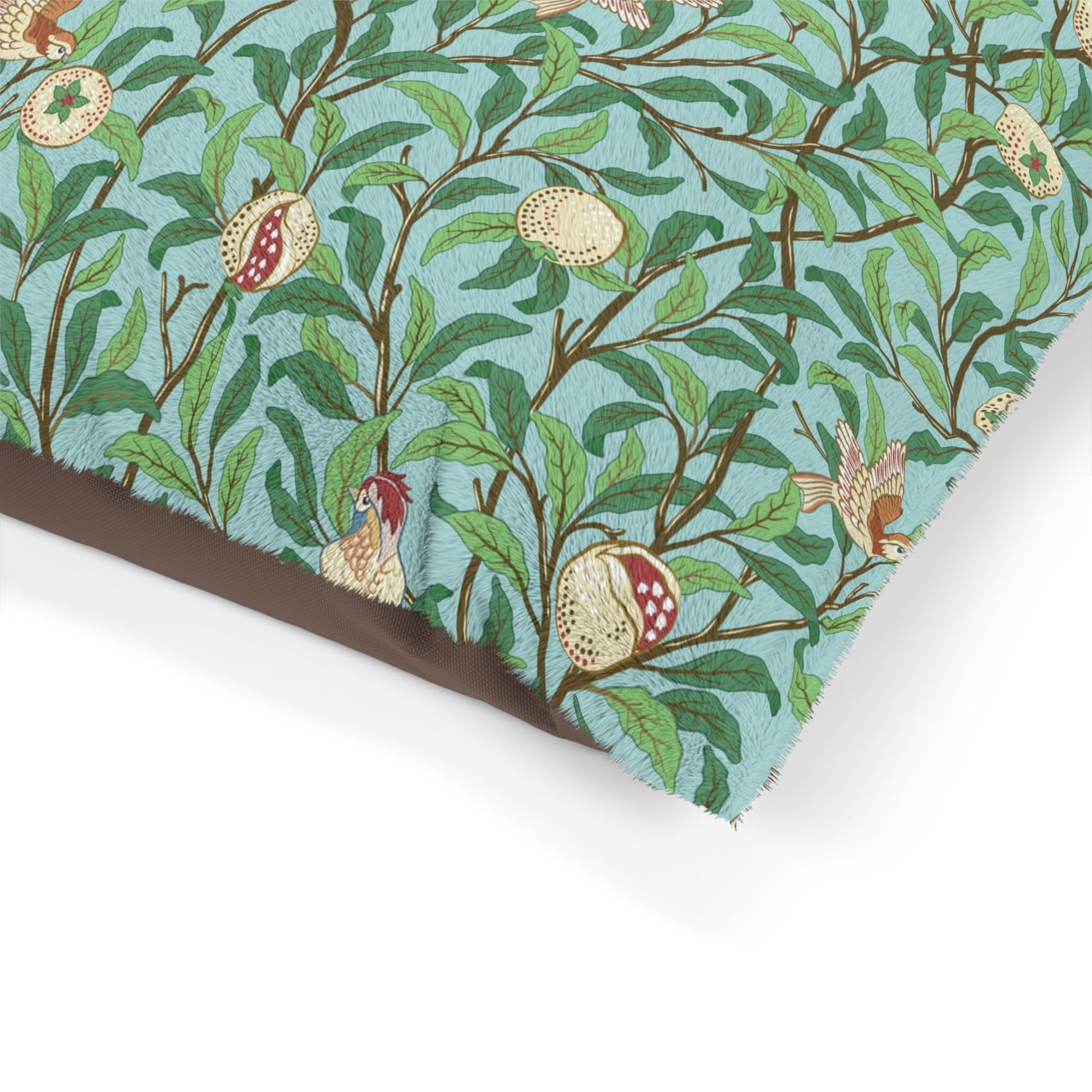 Fabric with a William Morris & Co nature-themed pattern featuring leaves, fruits, and birds on a blue background.