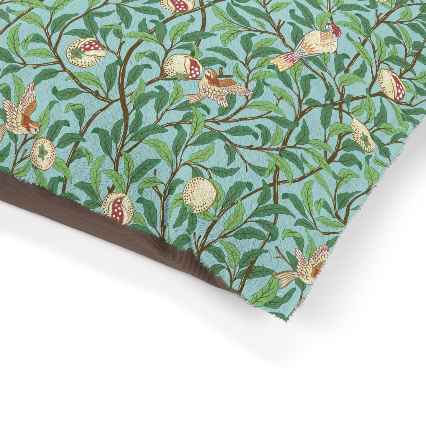 Fabric with a nature-themed William Morris & Co design featuring birds, leaves, and flowers on a teal background.