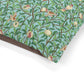 Fabric with a William Morris & Co pattern of birds and pomegranates on a blue background