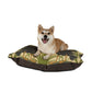 Dog lying on a decorative pet bed with a white background