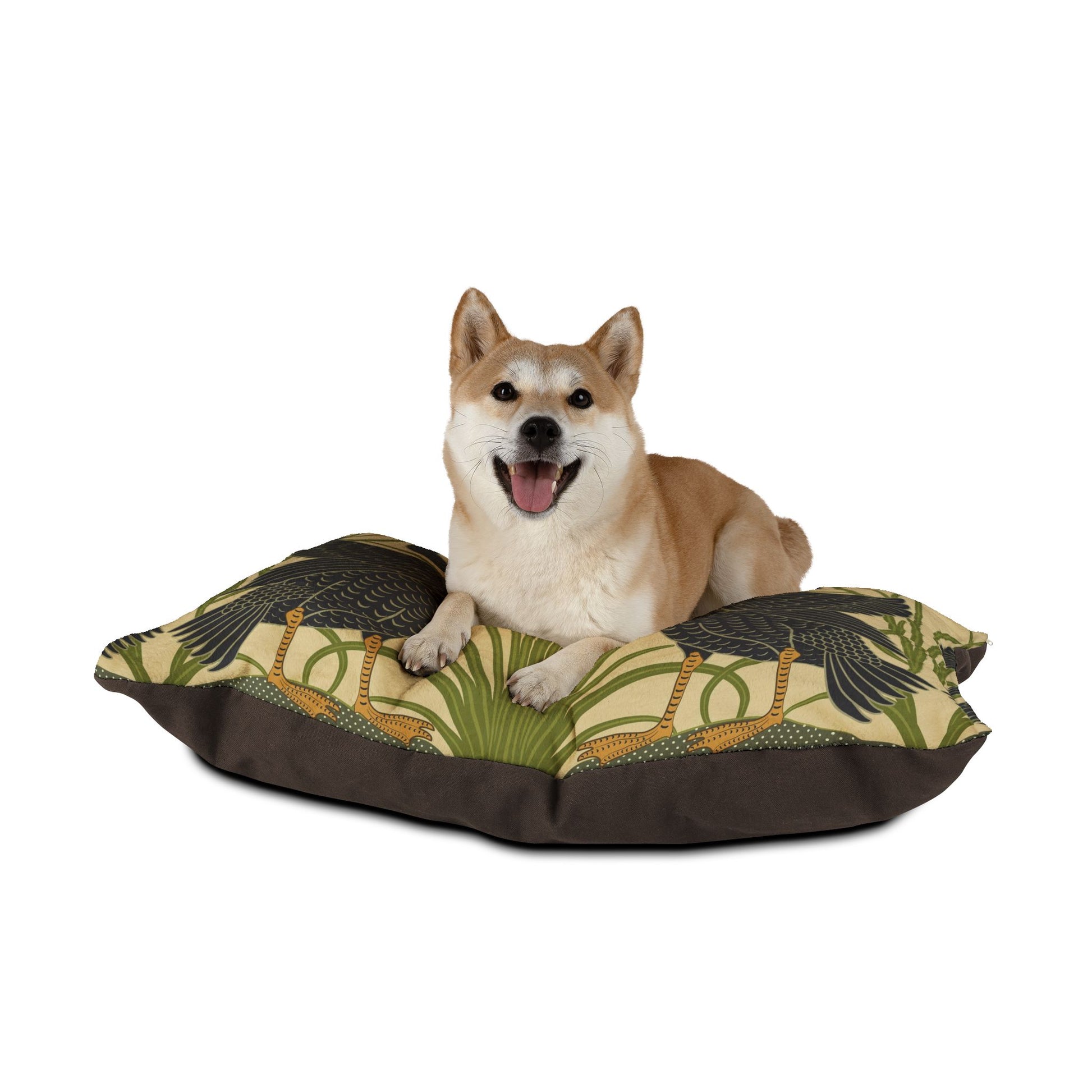 Dog lying on a decorative pet bed with a white background