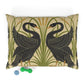 Decorative pillow with black swan design on a beige background