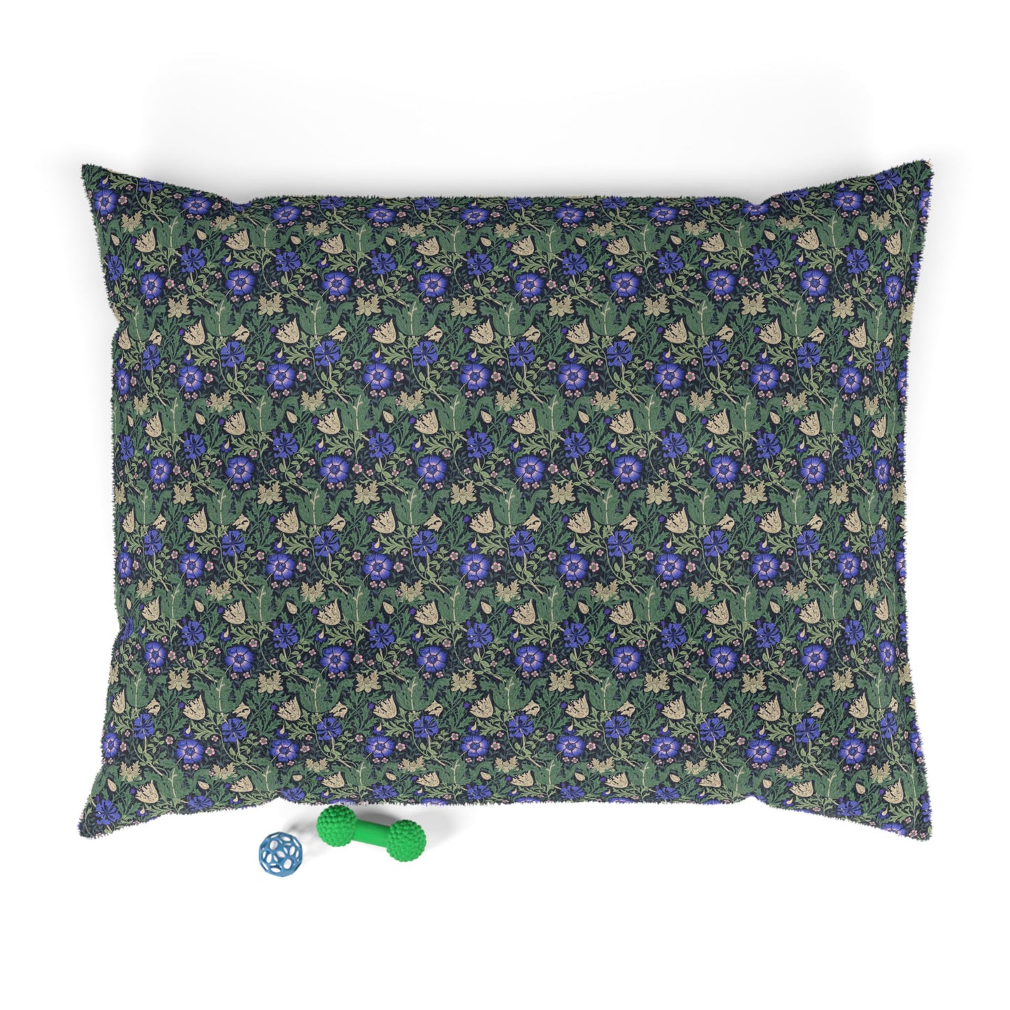 Floral patterned pet bed with dice and toy on a white background