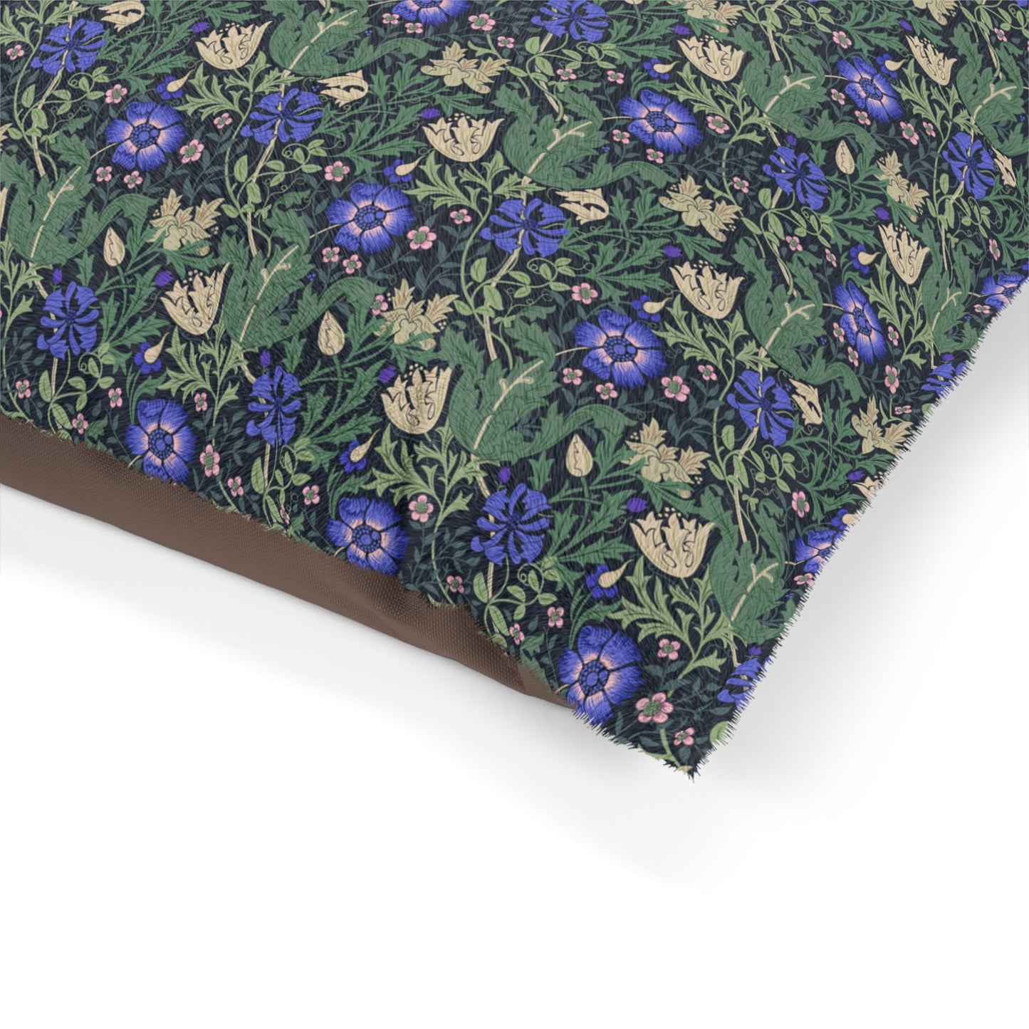 Floral patterned fabric with blue and purple flowers on a green background