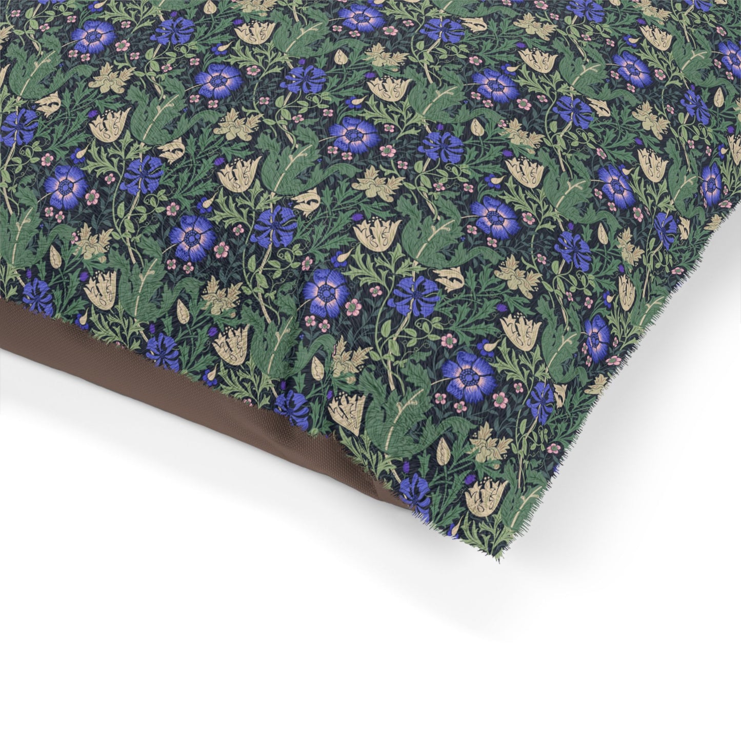 Floral patterned fabric with blue flowers on a green background