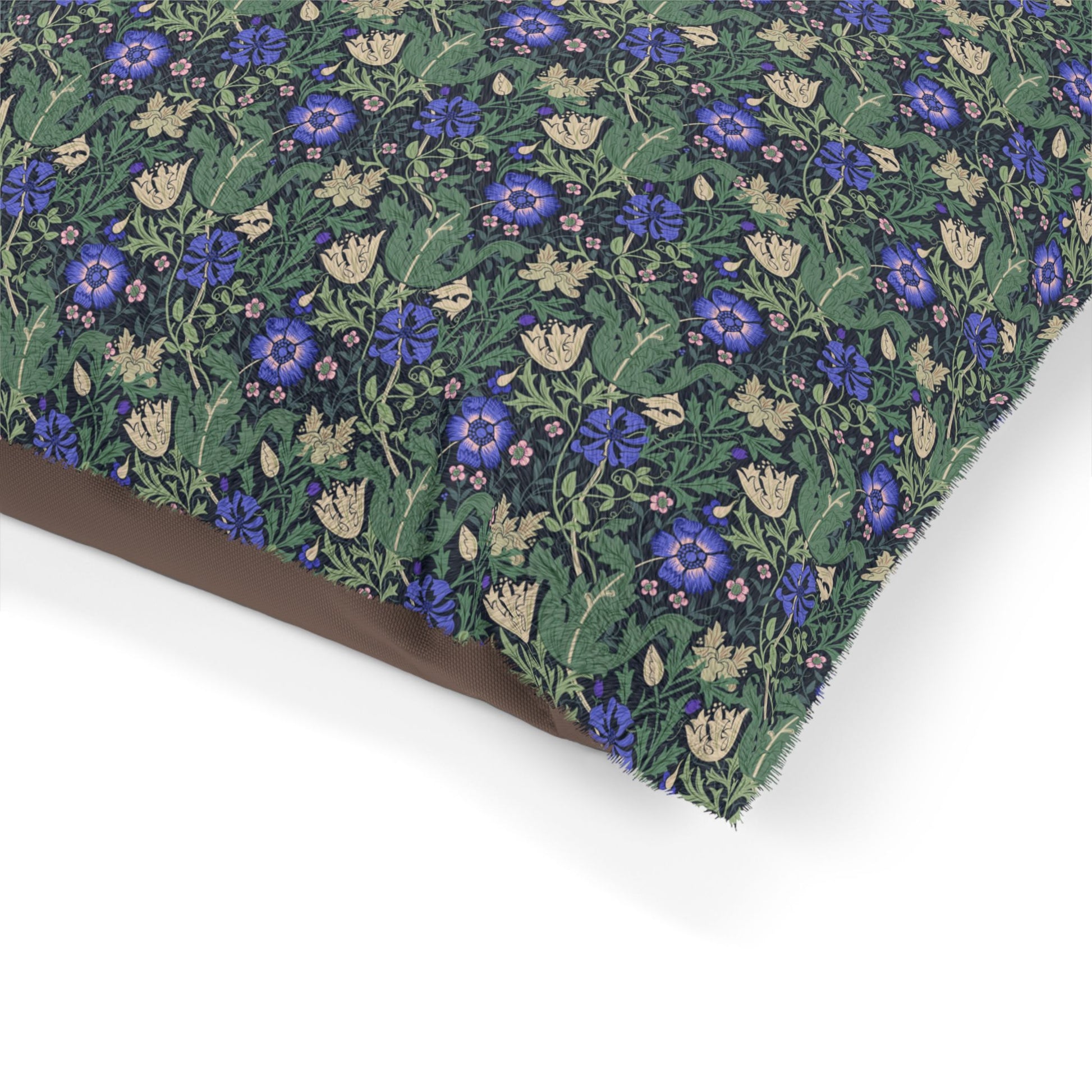 Floral patterned fabric with blue flowers on a green background