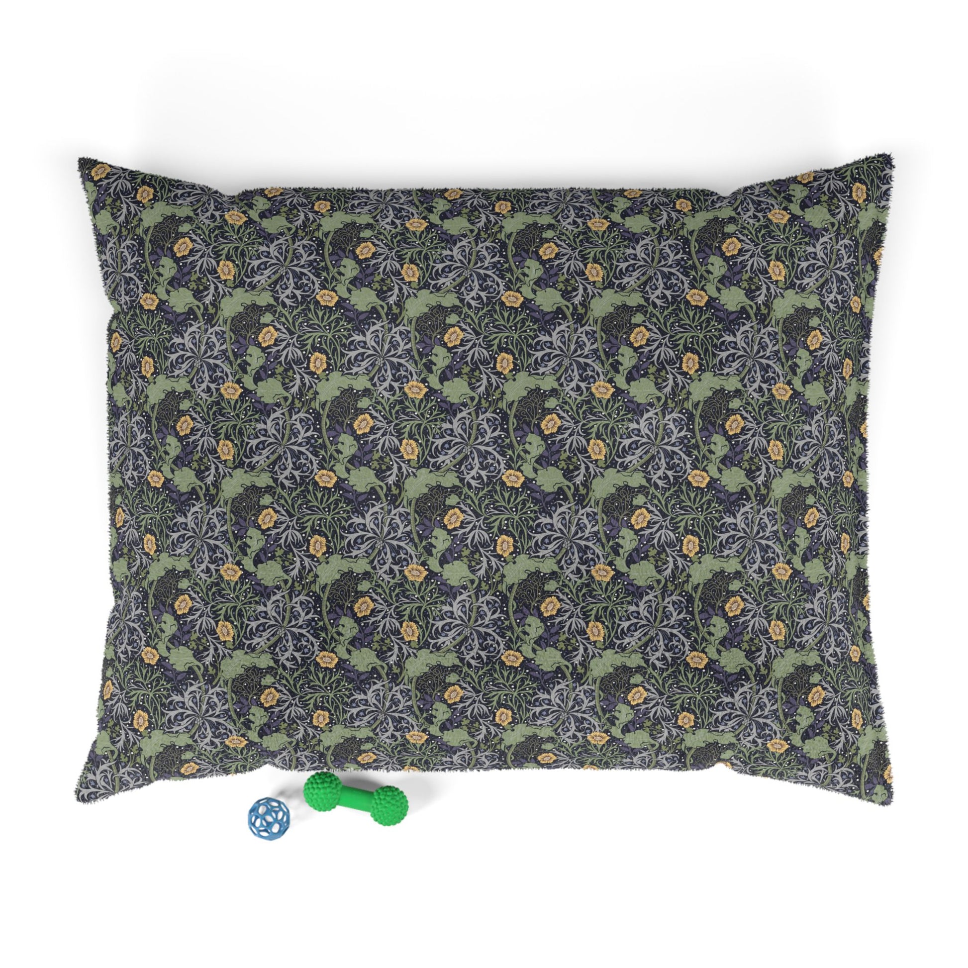 Floral patterned pet bed with a blue and green toy on a white background