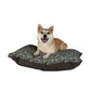Dog lying on a floral-patterned dog bed with a white background