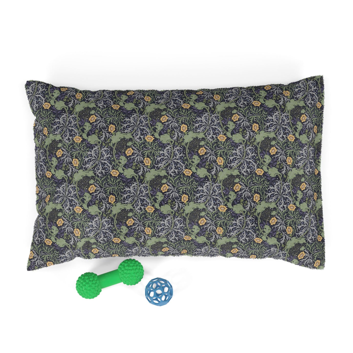 Floral-patterned pet bed with two toys on a white background