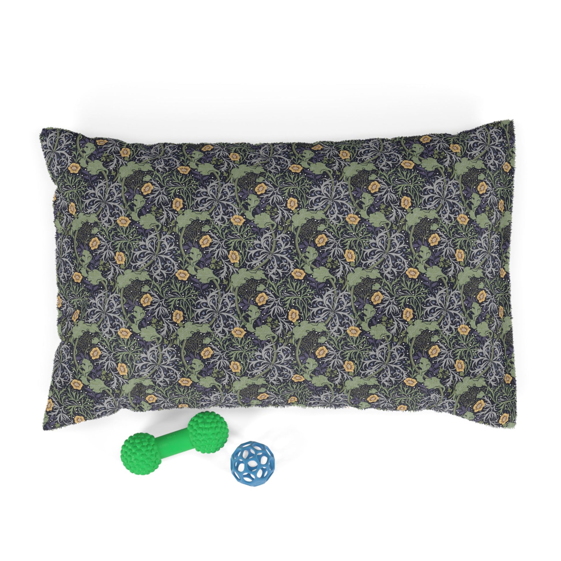 Floral-patterned pet bed with two toys on a white background