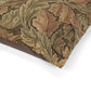 Close-up of a fabric with intricate William Morris & Co leaf pattern on a white background