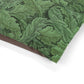 Green leaf patterned fabric on a white background
