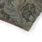 Close-up of a fabric with intricate leaf pattern on a white background