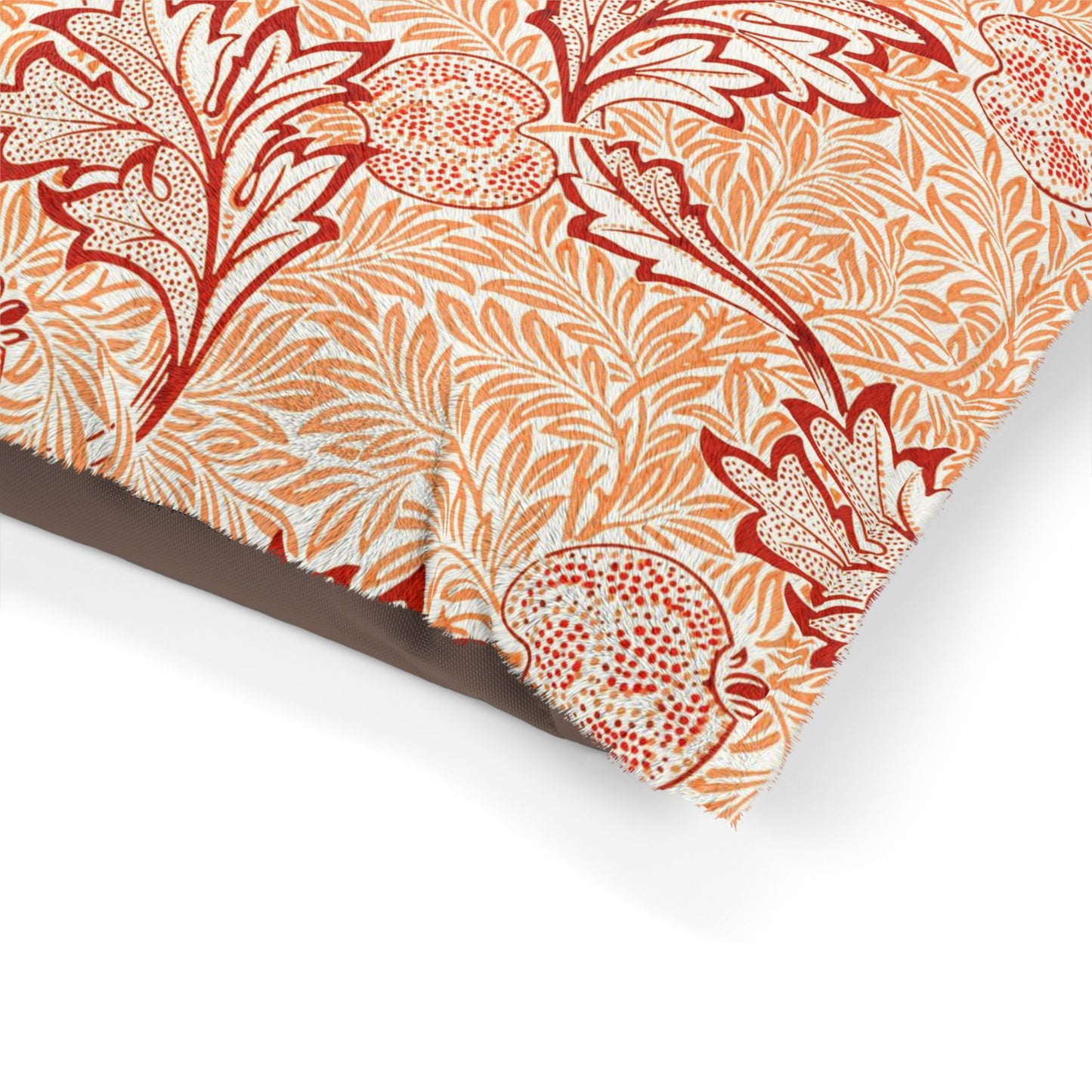 Floral patterned fabric with red and orange design on a white background