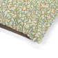 Patterned fabric with birds and leaves on a white background