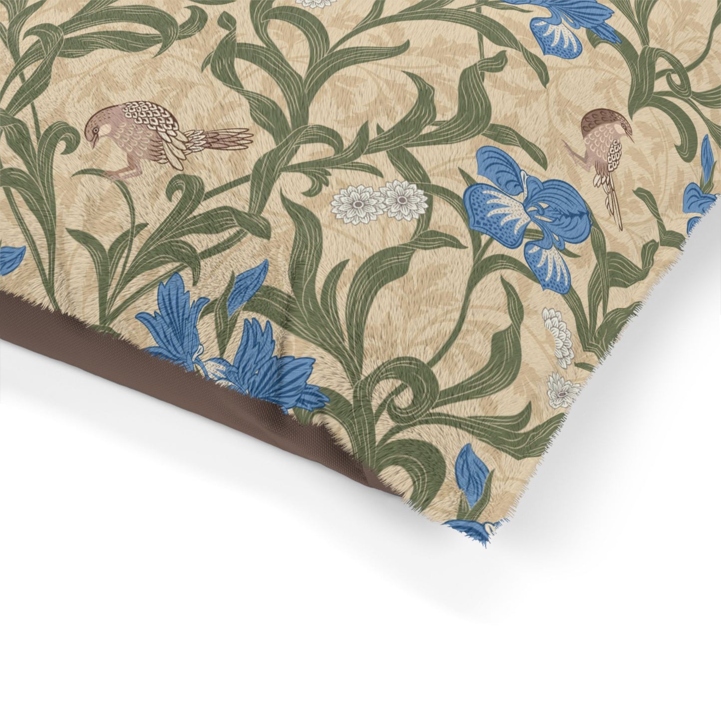 Floral and botanical William Morris & Co patterned paper with blue flowers and green leaves on a beige background.