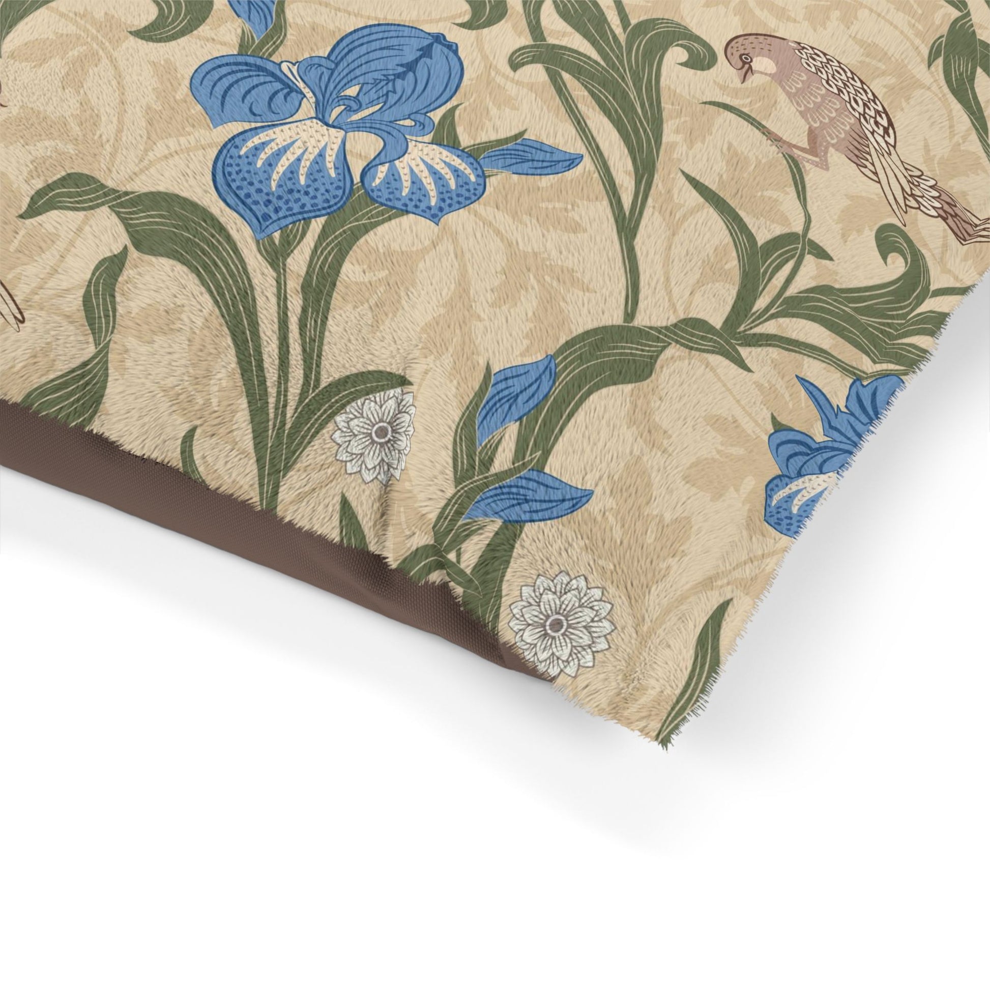 Decorative Dog Bed with William Morris & Co floral and parrot pattern on a beige background