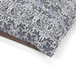 Floral and bird patterned fabric with a brown border on a white background