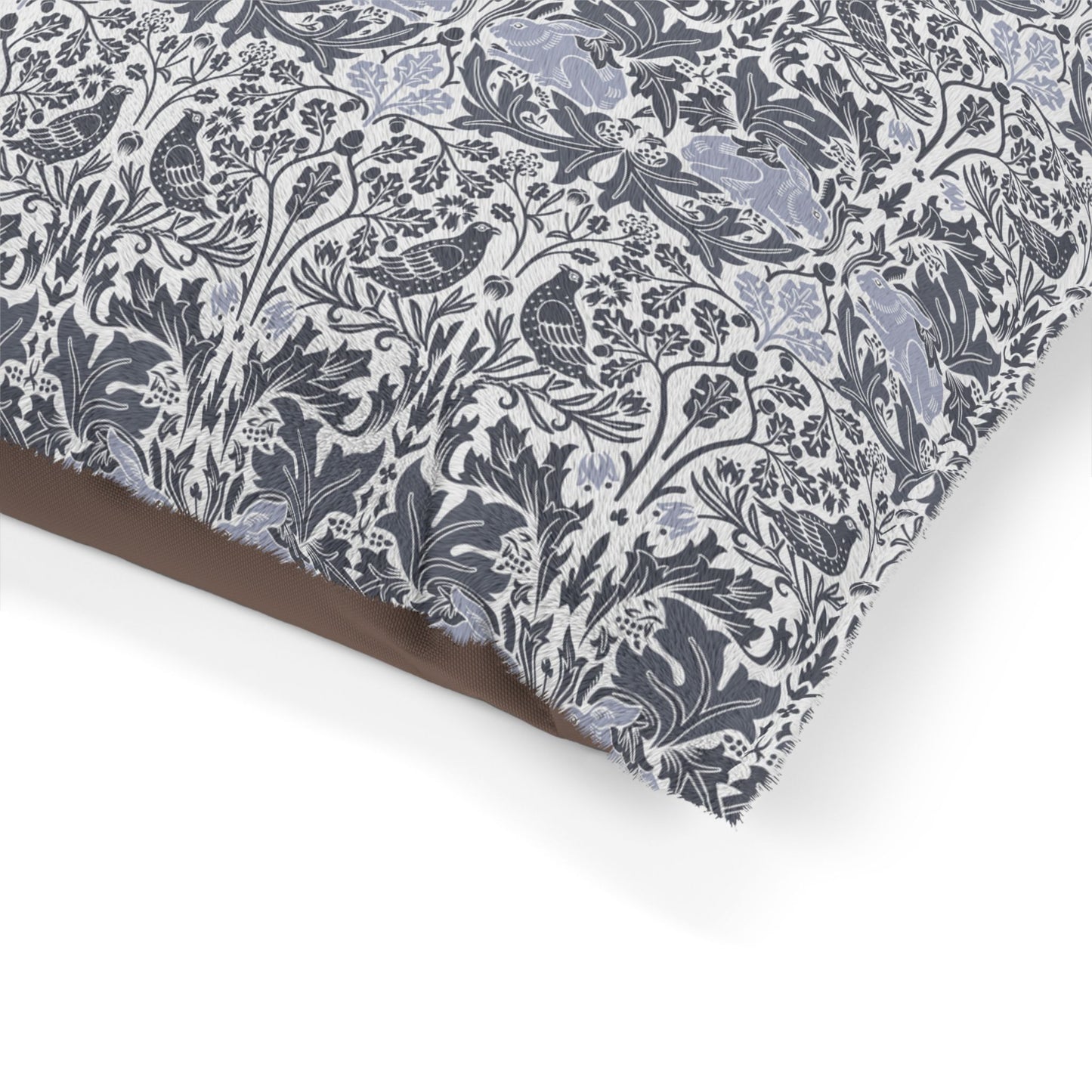 Floral and bird patterned fabric with a brown border on a white background