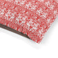 Red and white floral patterned fabric on a white background