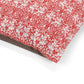 Red and white floral patterned fabric on a white background