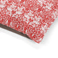 Red and white floral patterned fabric on a white background