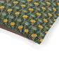 Fabric with a floral pattern featuring yellow flowers and green leaves on a white background