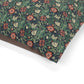 Floral patterned fabric with red, white, and green colors on a white background