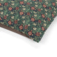 Floral patterned fabric with red and white flowers on a green background
