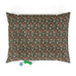 Floral-patterned pillow with small toys on a white background