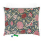 Floral William Morris & Co patterned pillow with two small toys on a white background